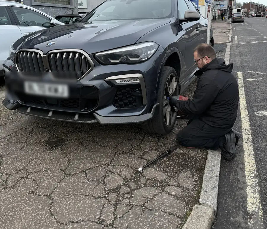 QuickGrip technician fitting a new tyre at the roadside