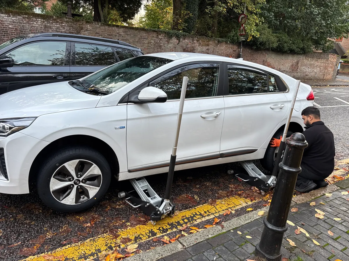 Joseph's photo of QuickGrip changing his tyre at the roadside